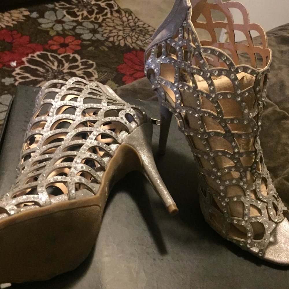 Silver with rhinestones peep toe heels.